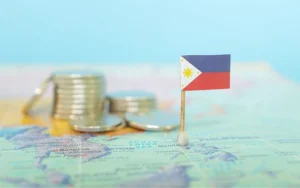 Hình ảnh gồm lá cờ Philippines và những đồng vàng tượng trưng cho sự phát triển.